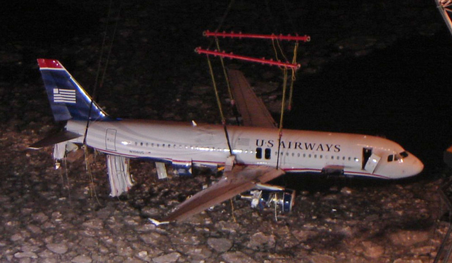 The Airbus A320 of Flight 1549 is hoisted from the frozen waters of the Hudson River two days after the accident (Spyropk)